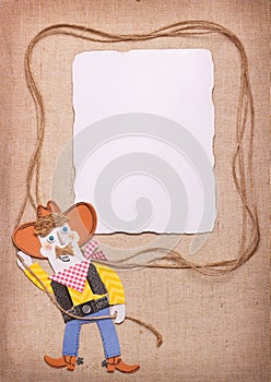 Cowboy in wild west hat with lasso and paper background. Paper c