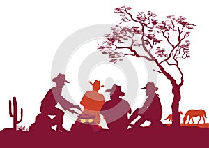 Cowboys around a campfire. Vector silhouettes on white for design photo