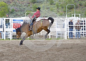 Cowboys competing in Ranch Bronc Riding