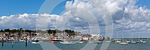 Cowes harbour Isle of Wight with boats and blue sky panorama