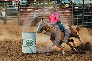 Cowgirl barrel racing at the Wyandotte County Kansas Fair Rodeo