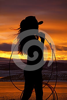 Cowgirl holding rope photo