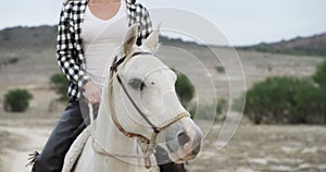 Cowgirl, horse and ranch for horseback riding in texas, countryside and ready with cowboy hat. fresh air, stable and