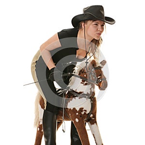 Cowgirl (jockey) race on hobbyhorse