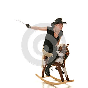 Cowgirl (jockey) race on hobbyhorse