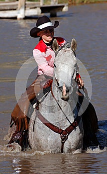 Cowgirl in Pond