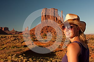 Cowgirl posing in monument valley