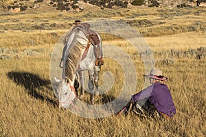 Cowgirl Sitting by Horse