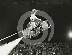 Cowgirl takes off on a rocket photo