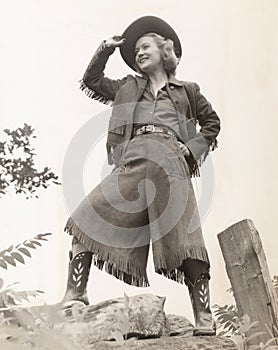 Cowgirl tipping her hat