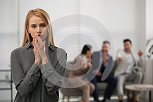 Coworkers bullying colleague in office, space for text