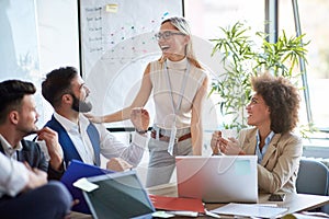 Coworkers laughing and joking around photo