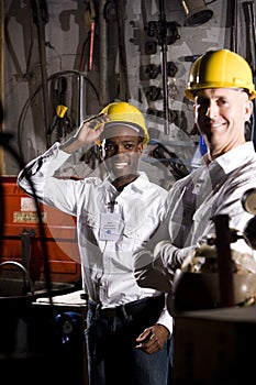 Coworkers in office maintenance room