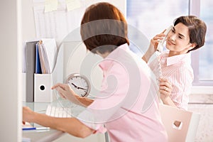 Coworkers sitting together at desk