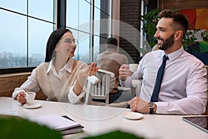 Coworkers talking in cafe during coffee break