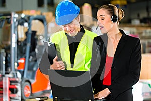 Coworkers at warehouse of forwarding company