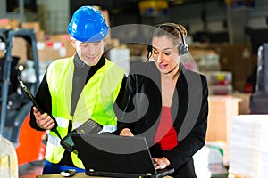 Coworkers at warehouse of forwarding company