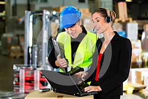 Coworkers at warehouse of forwarding company