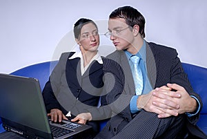 Coworkers working on laptop