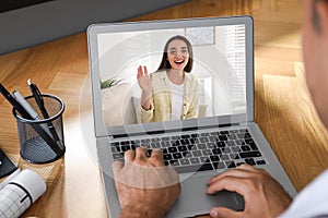 Coworkers working together online. Man using video chat on laptop