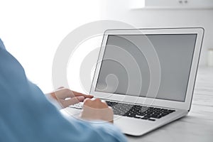 Coworkers working together online. Young woman using video chat on laptop, closeup