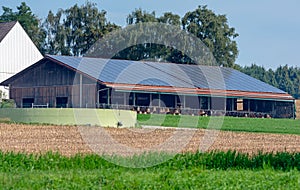 Cowshed with solar cells on the roof photo