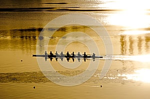 Rowing crew at sunrise photo