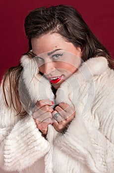 Coy Pinup Girl in Fur Coat