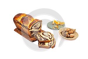 Cozonac, Romanian traditional sweet bread with walnut filling, sliced , side view isolated