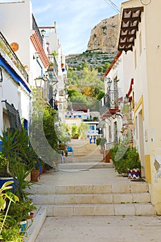 Cozy alley of Barrio Santa Cruz in Alicante, Costa Blanca, Spain photo