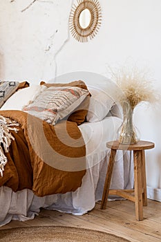 Cozy apartment in boho chic style interior with comfort bedroom