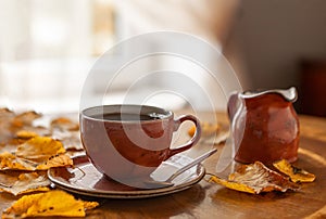 Cozy autumn photo with a cup of coffee