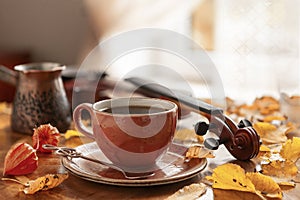 Cozy autumn photo with a cup of coffee and a violin