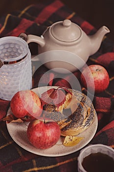 Cozy autumn weekend morning at home. Breakfast with cup of tea and bagel with apples