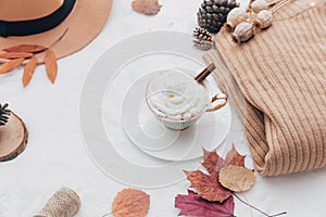 Cozy Autumn and Winter composition. Hot coffee with warm sweater,