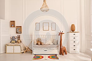 Cozy baby room interior with crib and toys