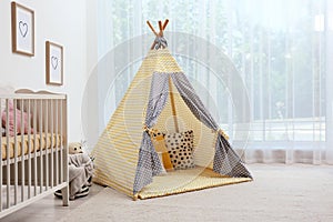 Cozy baby room interior with play tent