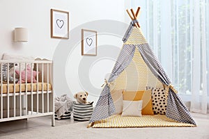Cozy baby room interior with play tent