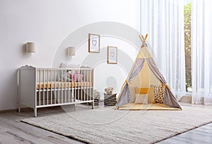 Cozy baby room interior with play tent