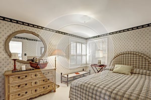 Cozy bedroom design in grey tones features beige grass papered walls