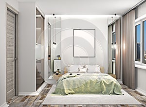 Cozy bedroom with a wardrobe with mirrored doors next to the bed. Blank canvas hung on the wall above the bed.