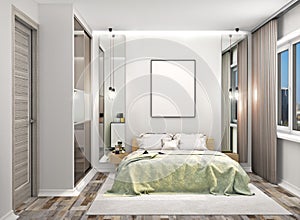 Cozy bedroom with a wardrobe with mirrored doors next to the bed. Blank canvas hung on the wall above the bed. photo