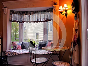 Cozy breakfast nook in bright bay window