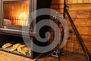 Cozy burning flame in the fireplace in a private house