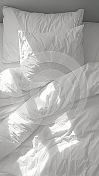 Cozy chaos Messy white bedding sheets and pillows, black and white