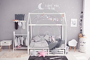 Cozy children`s bedroom in scandinavian style with diy accessories