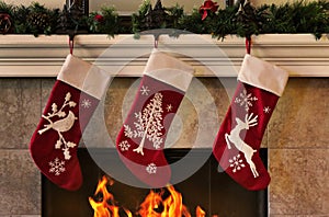 Cozy Christmas fireplace with three red stockings