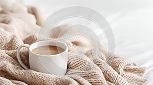 The cozy coffee cup resting on a soft blanket in a serene setting. AI generated image
