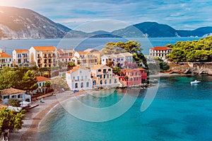 Cozy colorful town Assos with red roofs at the lush green Mediterranean place of Kefalonia Island, Greece