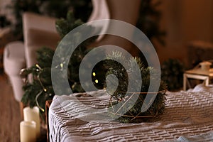 Cozy decor in the interior of the New Year& x27;s room, Christmas tree, garlands, gifts, bed. Festive atmosphere in the